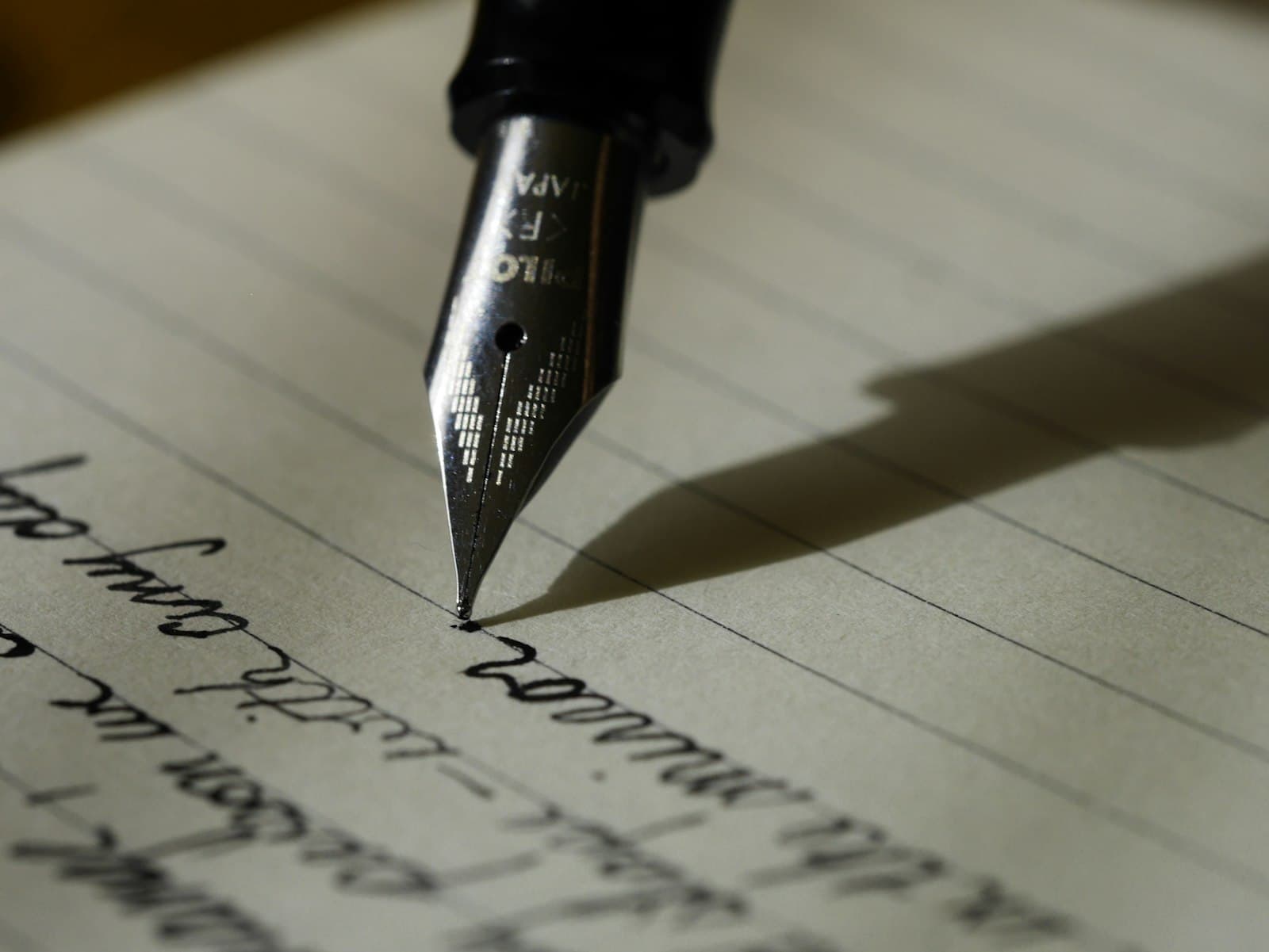 Hands writing a ceremony script by hand